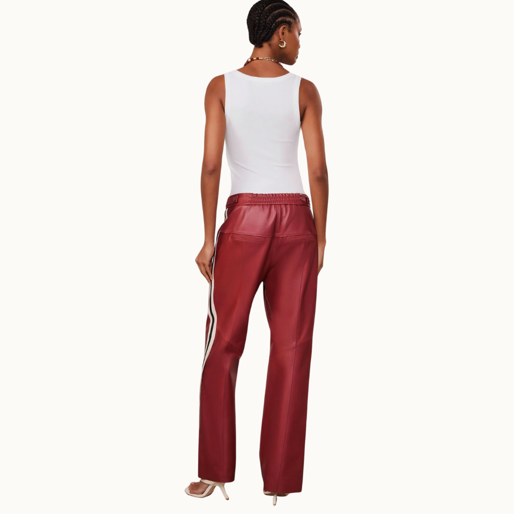 CALCA DE COURO LISTRA LATERAL BOTOES