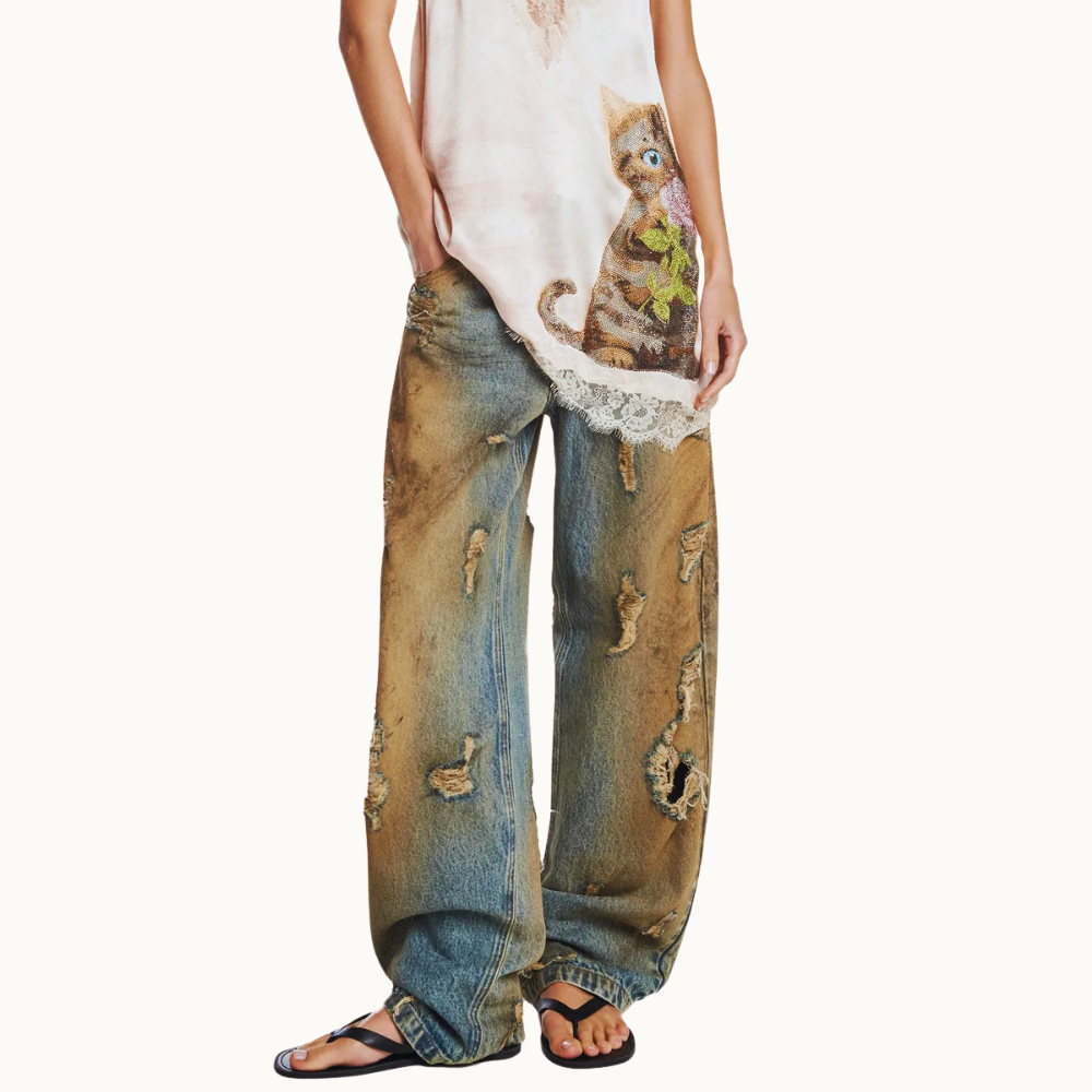 CALÇA JEANS BALLOON MANCHADA COM RASGOS