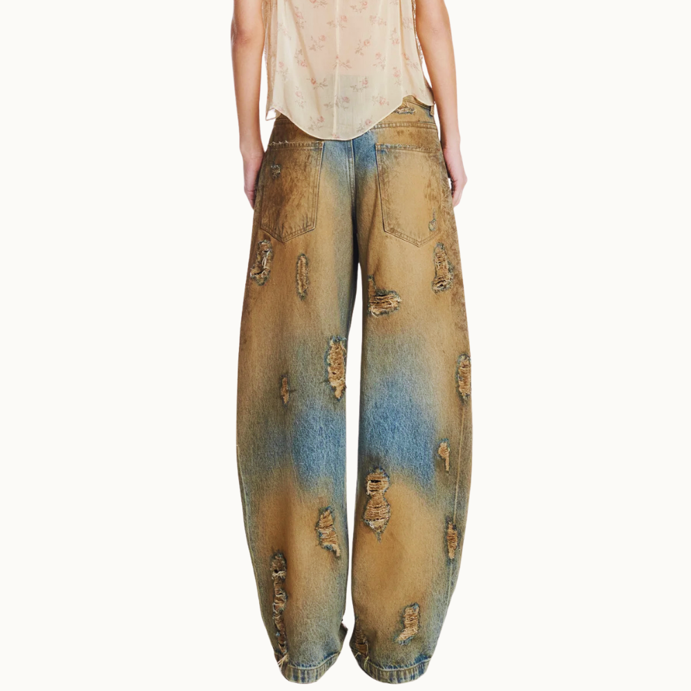 CALÇA JEANS BALLOON MANCHADA COM RASGOS