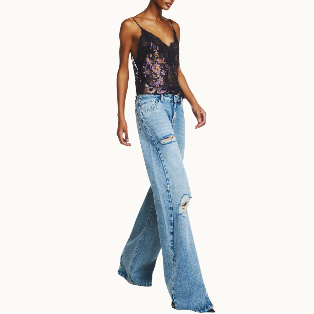 CALÇA JEANS FLARE RASGOS CINTURA BAIXA COSTURA LATERAL