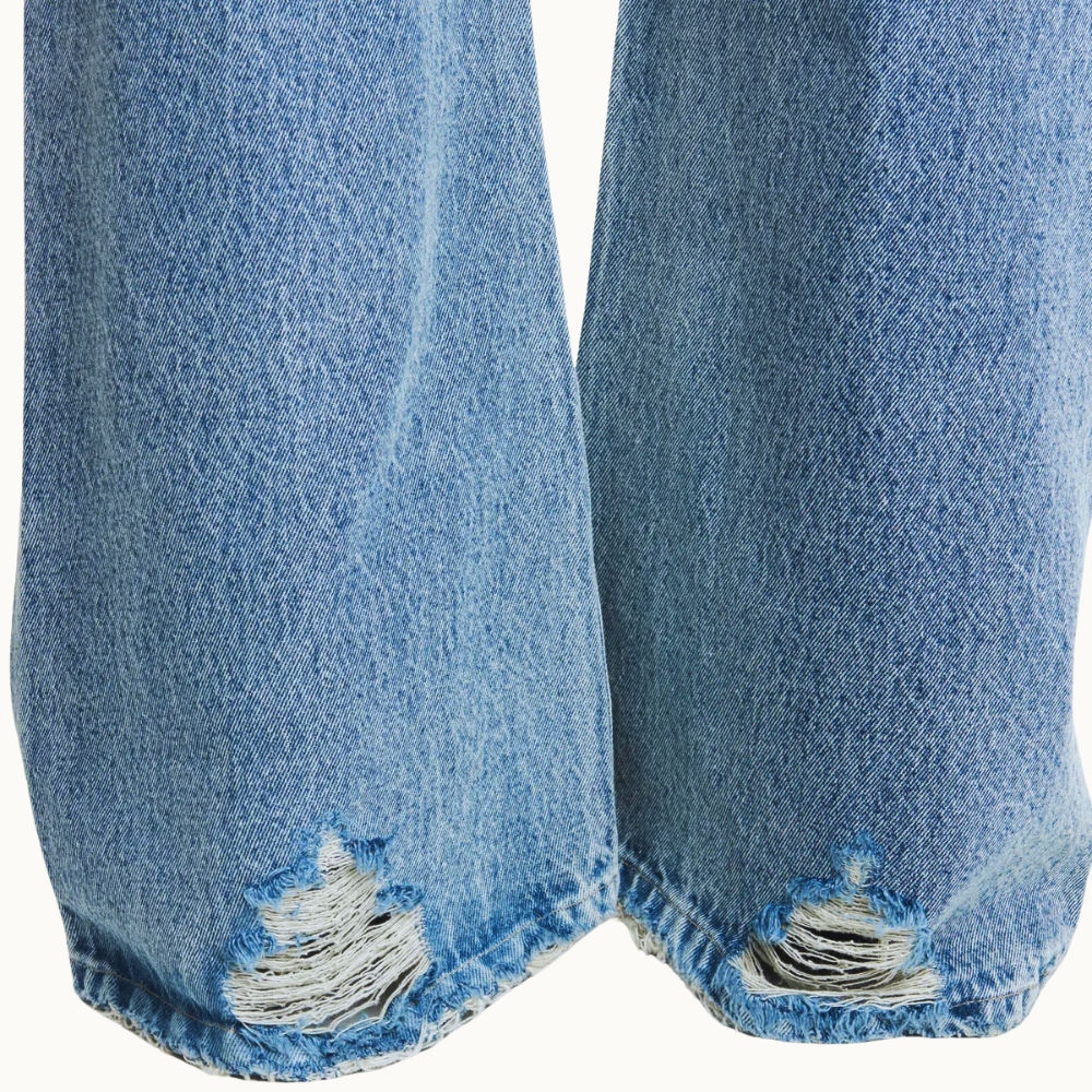 CALÇA JEANS FLARE RASGOS CINTURA BAIXA COSTURA LATERAL