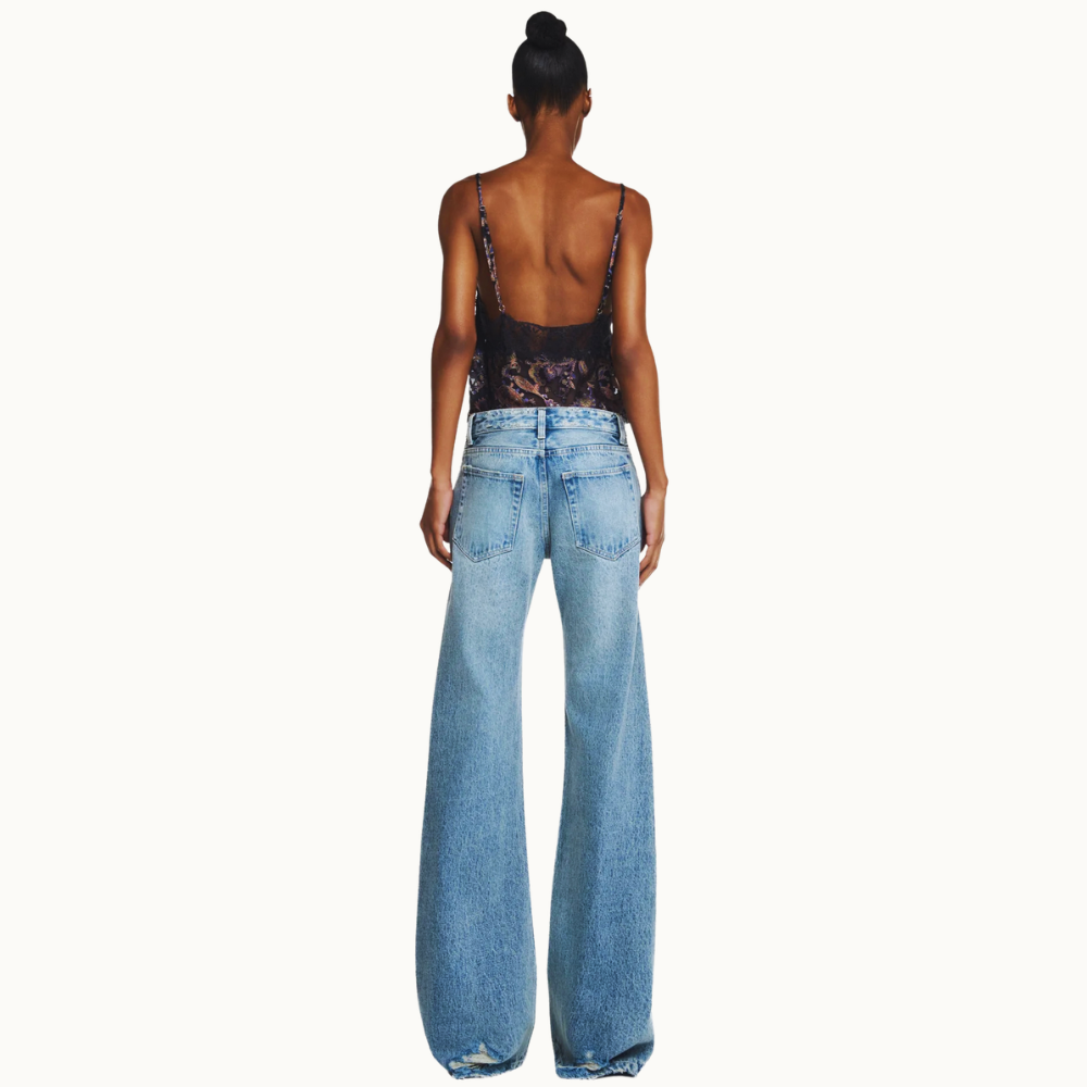 CALÇA JEANS FLARE RASGOS CINTURA BAIXA COSTURA LATERAL